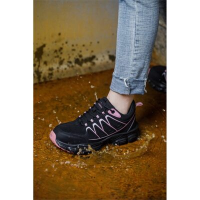 Black and pink slip resistant work shoe in wet floor scene