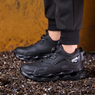 Wear resistant black work shoes on metal shavings
