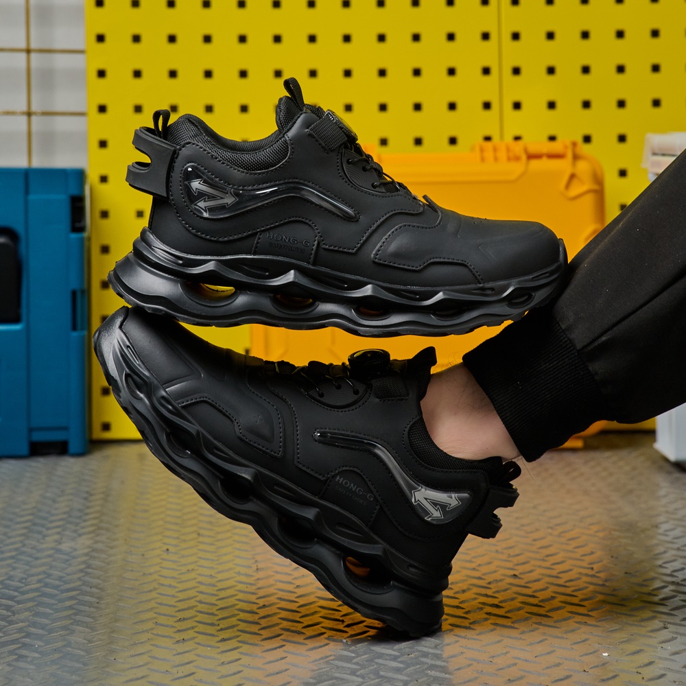 Flexible black steel toe work shoes in motion