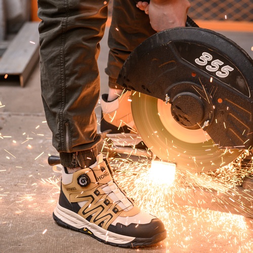 Steel toe welding work boots around grinding sparks