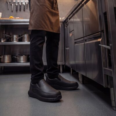 Black chef shoes in a professional kitchen