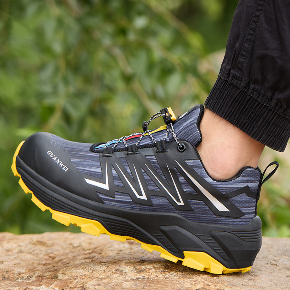 Black/Yellow steel toe shoes in an outdoor work scene
