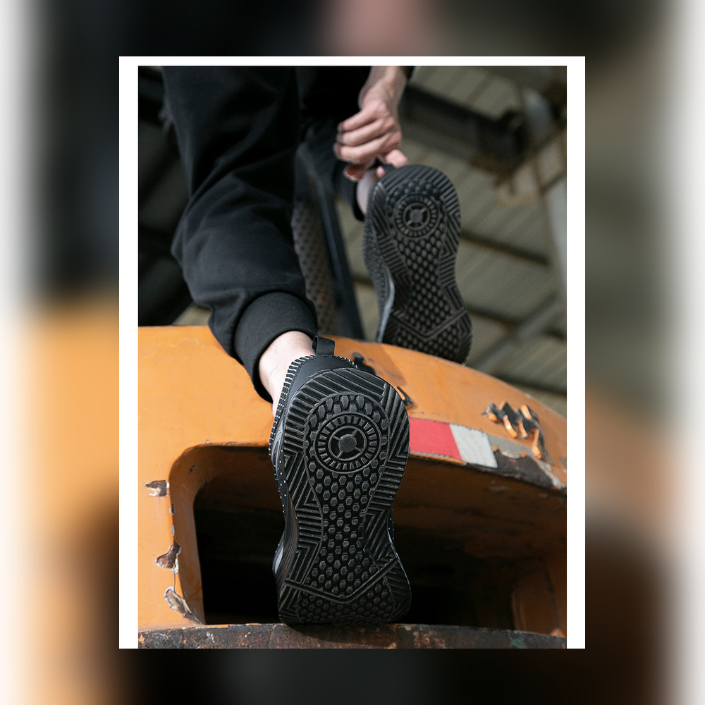 Black metal free work shoes with the complete outsole visible