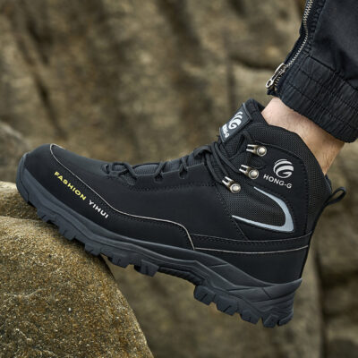 Black steel toe boots in an outdoor work scene