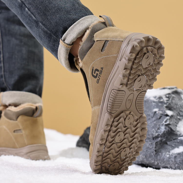 Rugged outsole grip on tan winter steel toe work shoes
