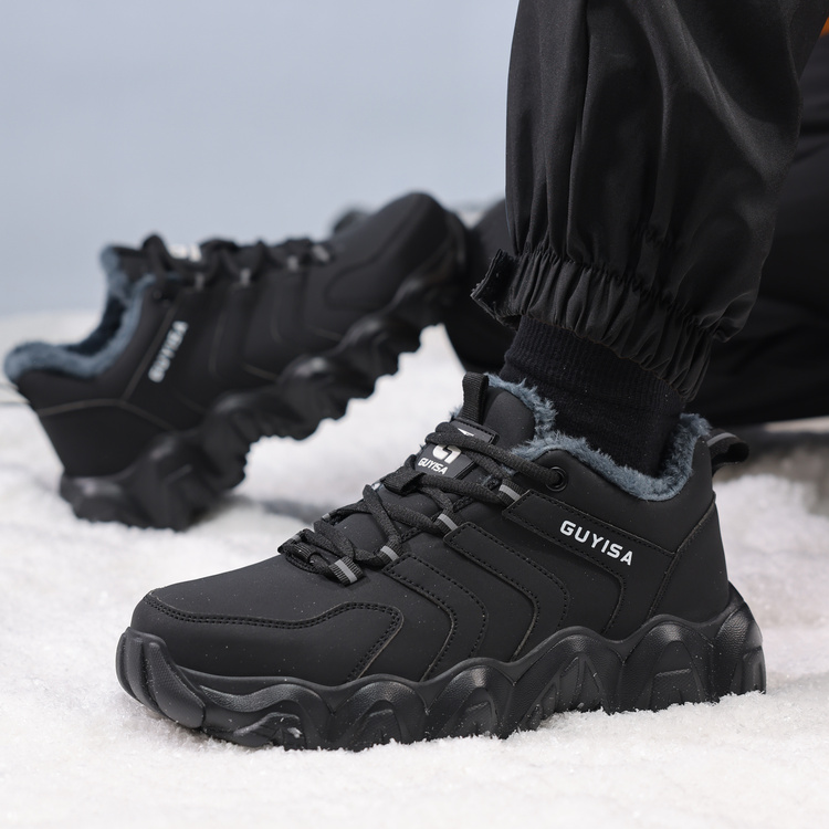 Black fleece lined steel toe work shoes worn in snow