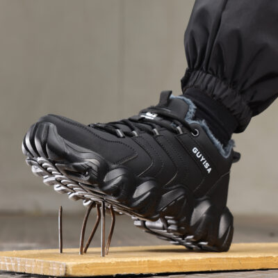 Black puncture-resistant steel toe work shoe on nails