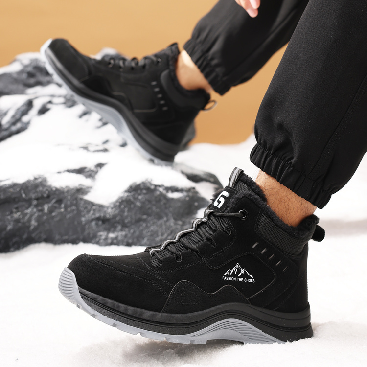 Black fleece lined steel toe boots worn in a snowy work setting
