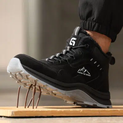 Black puncture-resistant safety boot on nails