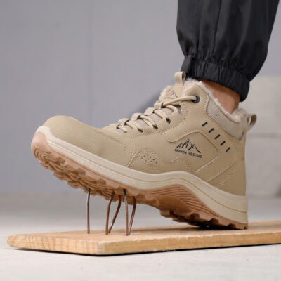 Beige puncture-resistant composite toe work boot on nails