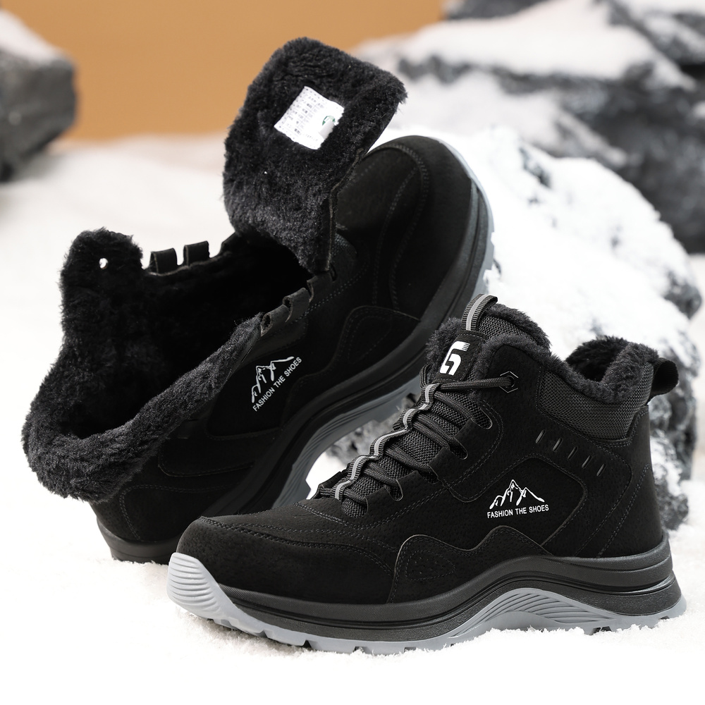 Black fleece lined composite toe work boots in snow