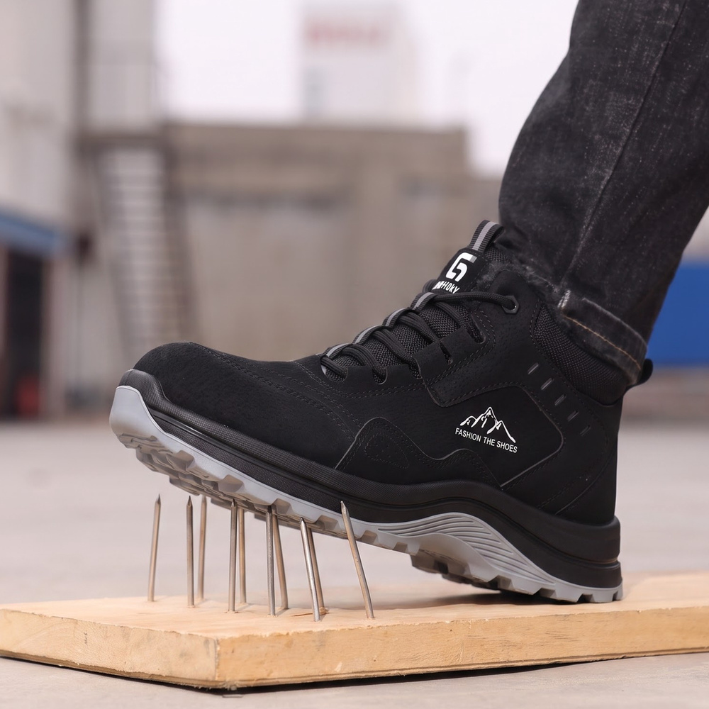 Black puncture-resistant composite toe work boot on nails