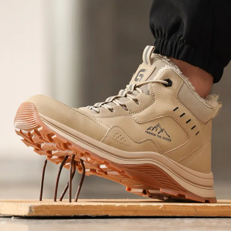 Puncture resistant midsole on beige steel toe safety boots