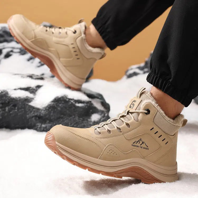 Flexible cushioned beige steel toe safety boots in motion