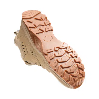Rugged segmented outsole on beige steel toe boot
