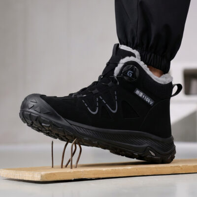 Black puncture-resistant composite toe work boot on nails