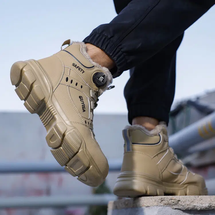 Durable traction outsole on tan winter work boots